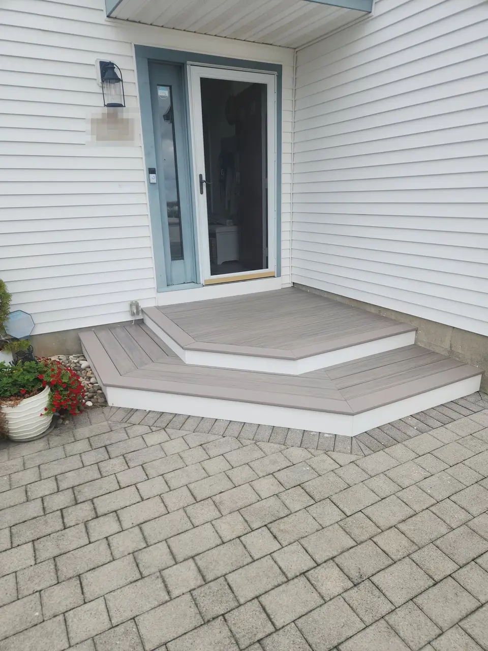 Composite front steps with a wraparound landing